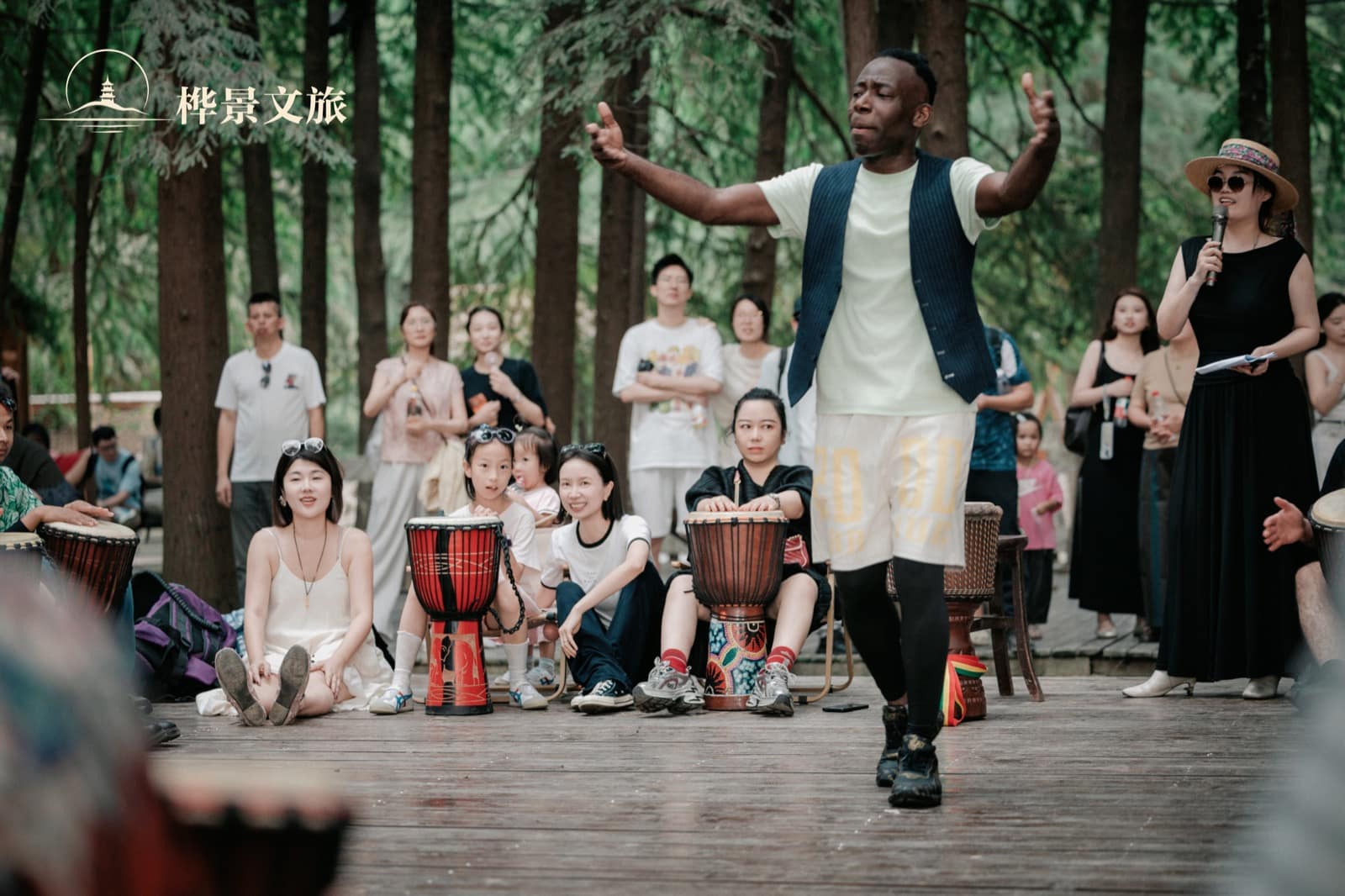 A group drum circle during the Qingshan Lake cultural exchange